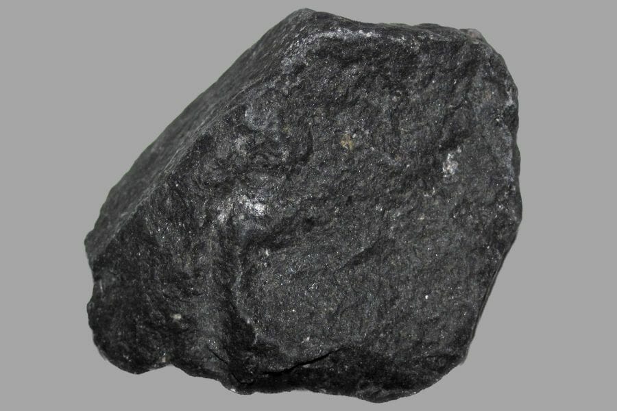 A solid black Basalt with impurities