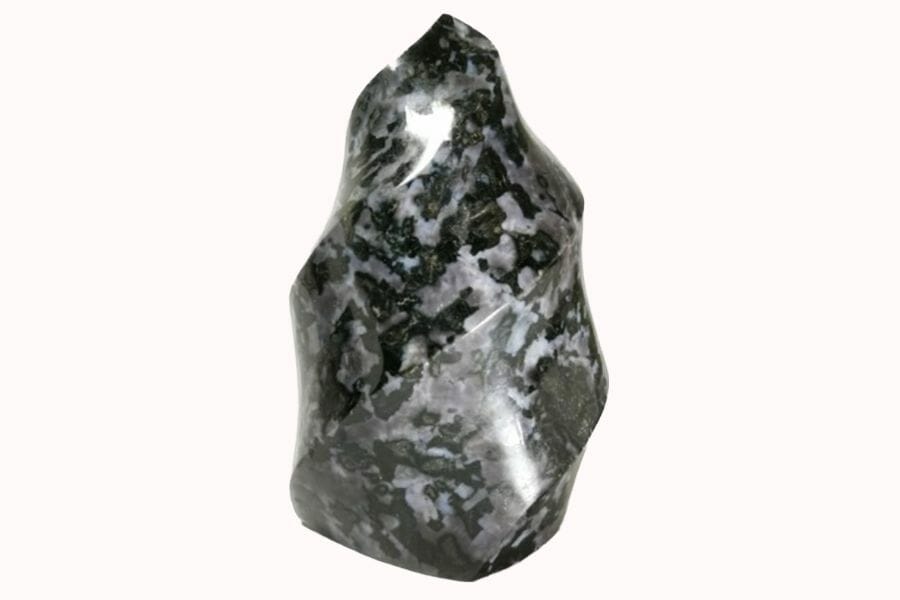 A swirl-shaped Merlinite with patches of black and gray colors