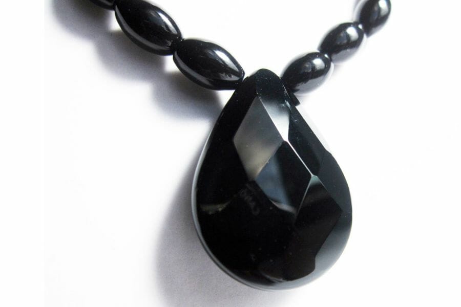 A shiny tear-shaped black Onyx used as pendant