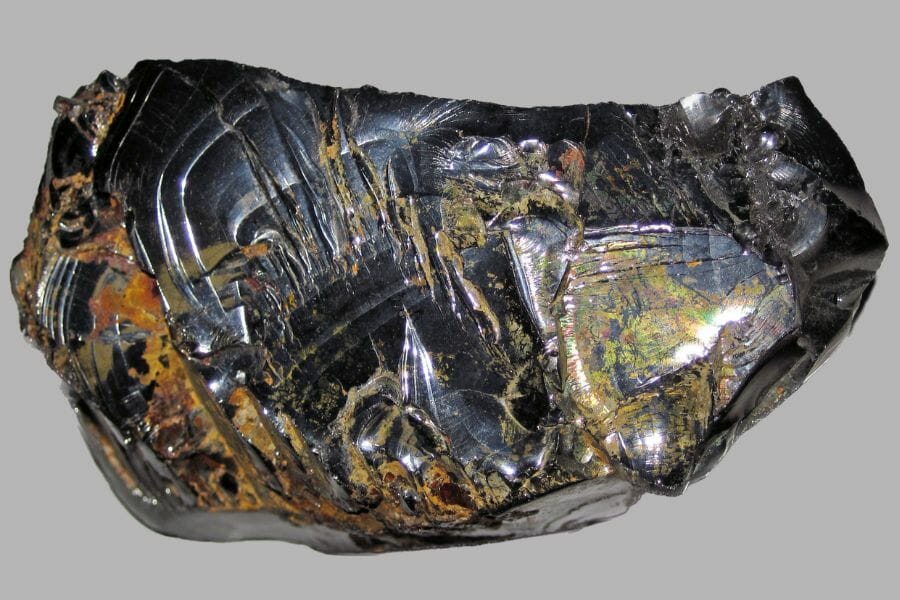A big, shiny black Shungite with golden lines