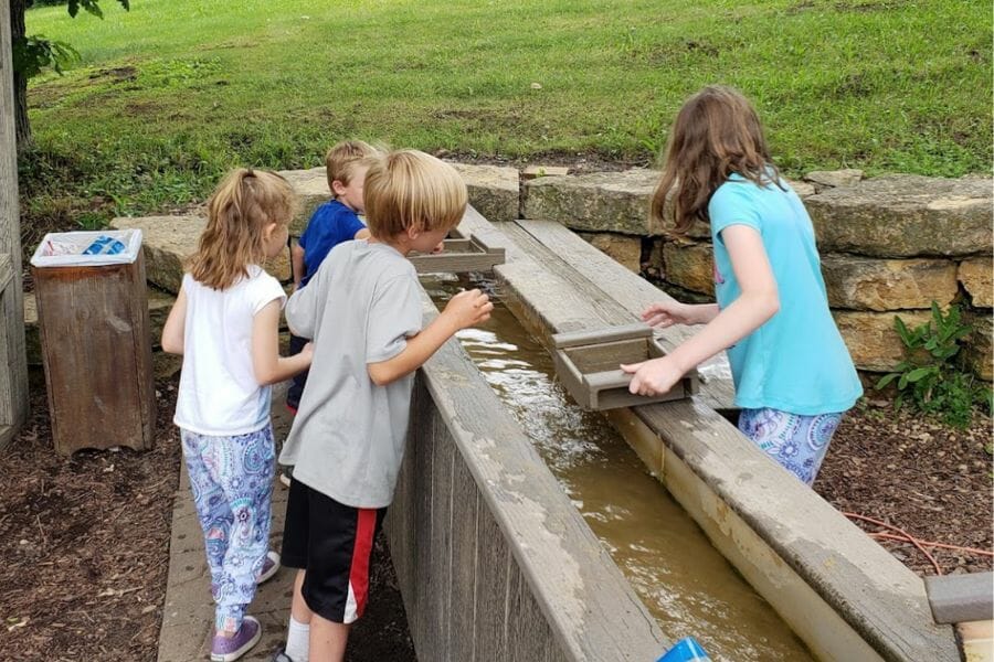 Children looking for gemstones at Crystal Cave Lake