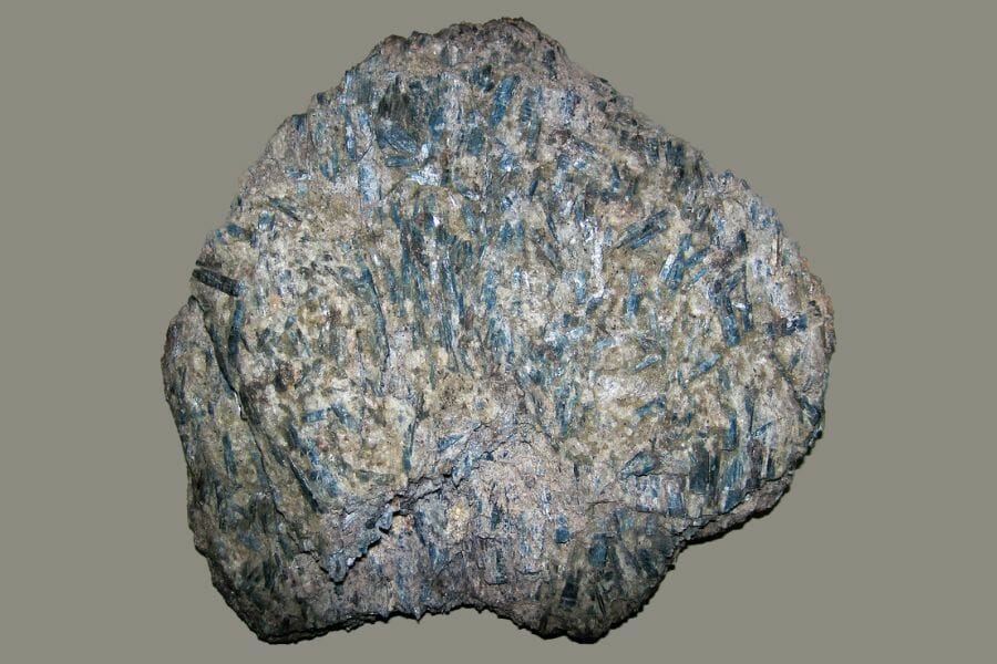 Bits of light blue Kyanite beautifying a rock found while gem mining in Florida