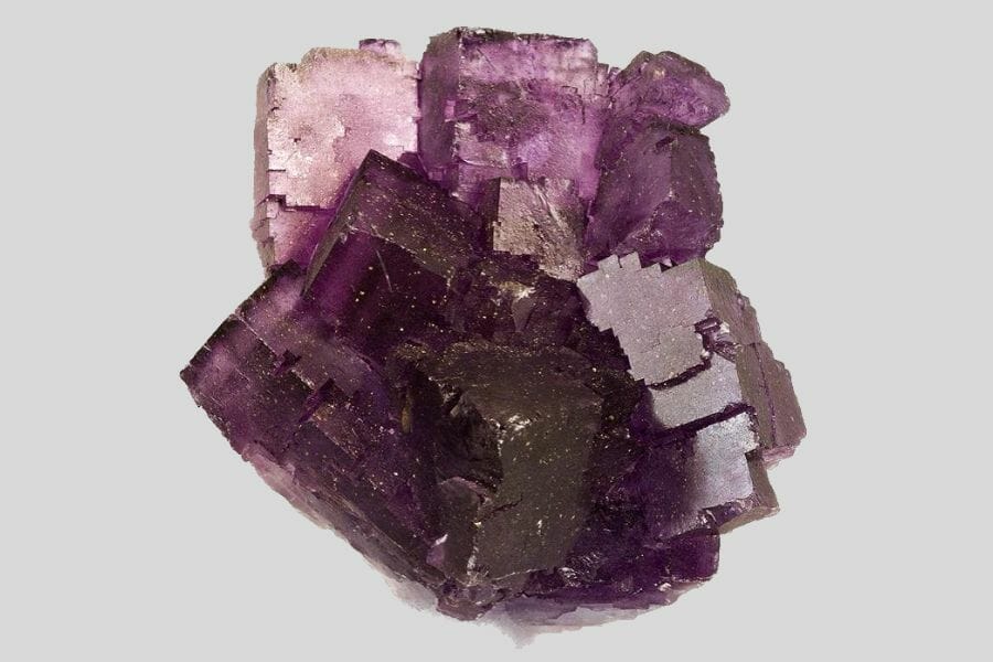 A beautiful, purple Fluorite against a light gray background