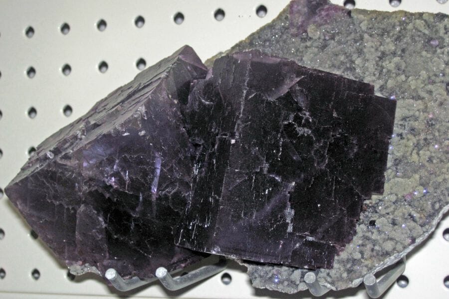 A deep violet Fluorite attached to a rock found while gem mining here
