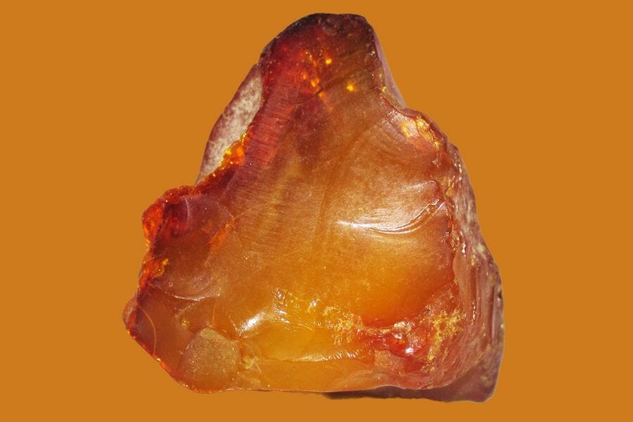 An orange Amber with a yellowish, shiny center
