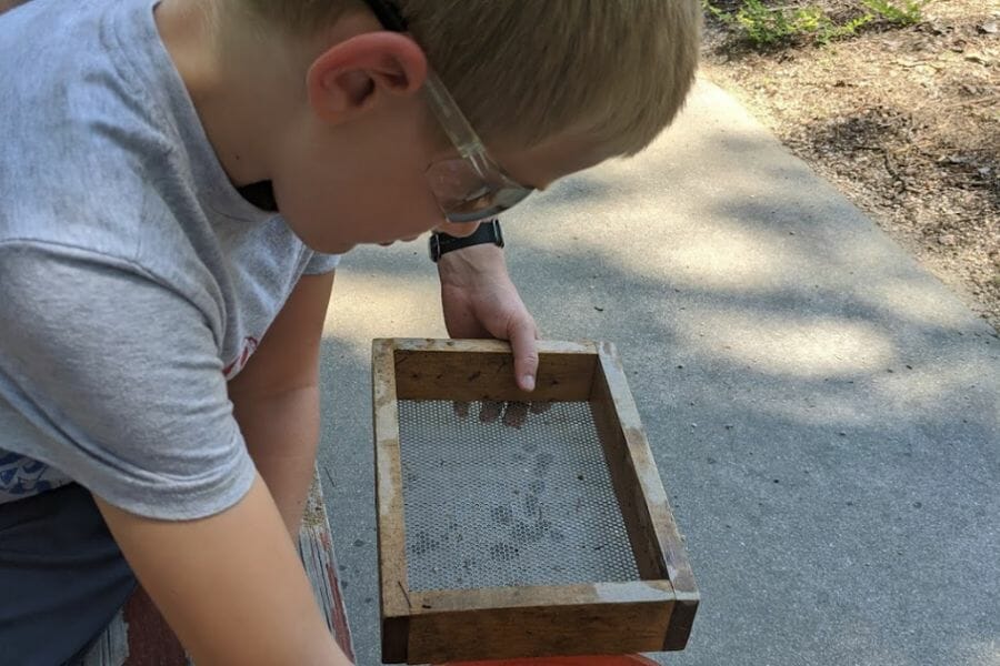 A kid looking for gems at Lucky Lake Gem Mine