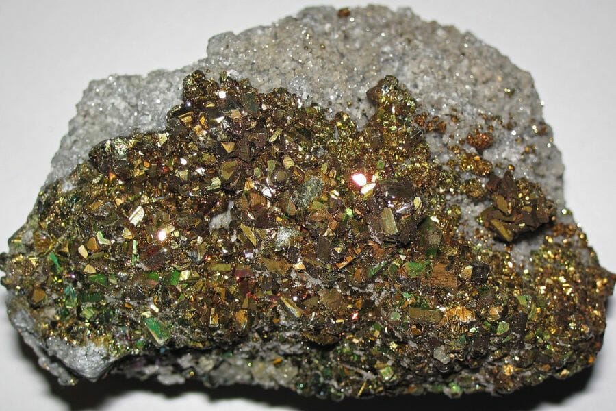 Gold-looking Pyrite attached in crystal stone found while gem mining