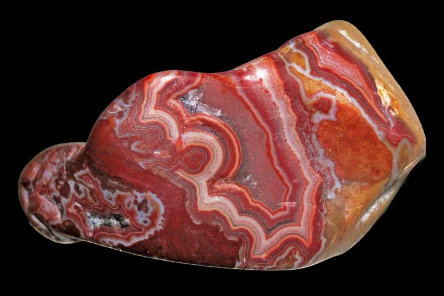 A Fairburn Agate with swirls of red, orange, and yellow colors