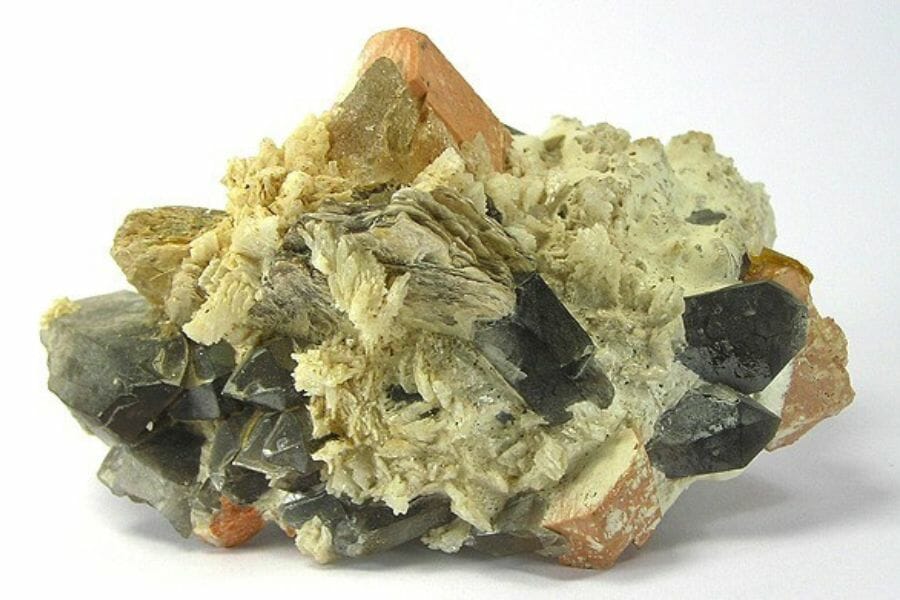 A group of Quartz, Feldspar, and Topaz mounted on a single rock found while gem mining in New Hampshire
