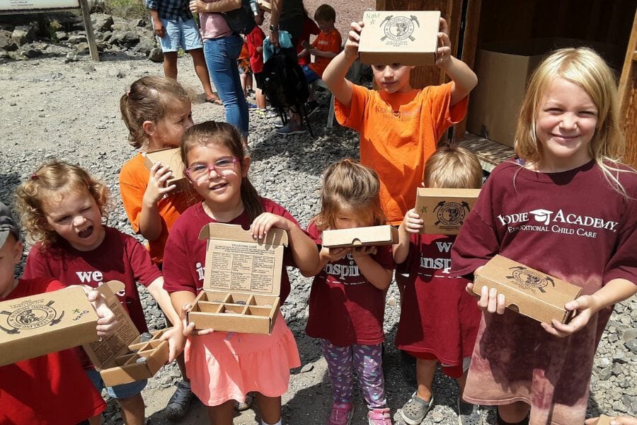 Kids proudly show off the different gems they found at the Sterling Hill Mining Museum.