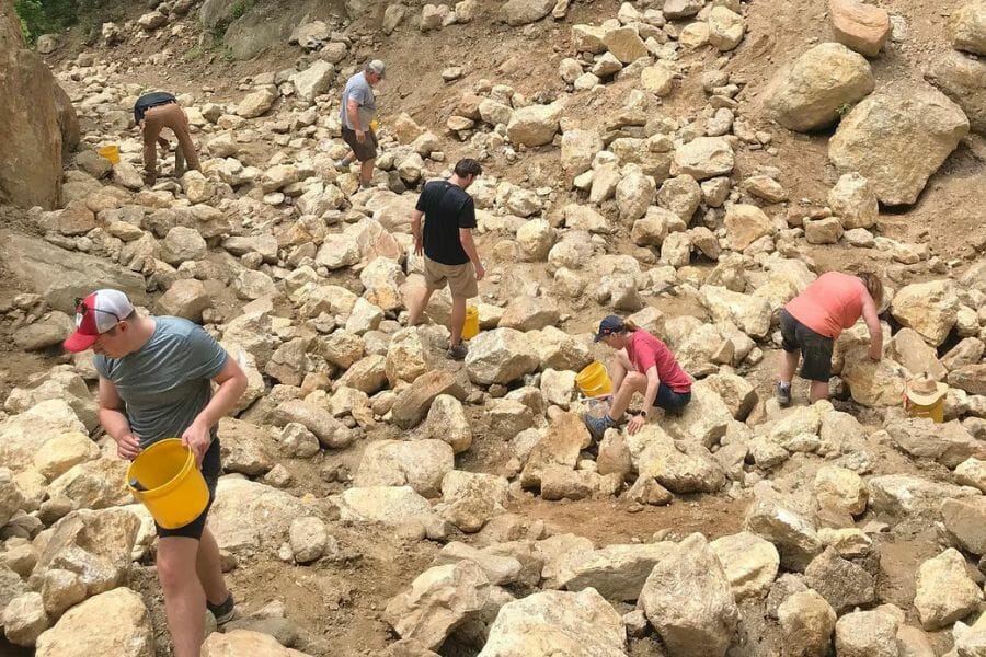Adults enjoying their mine trip at the Gem Mountain Gemstone Mine