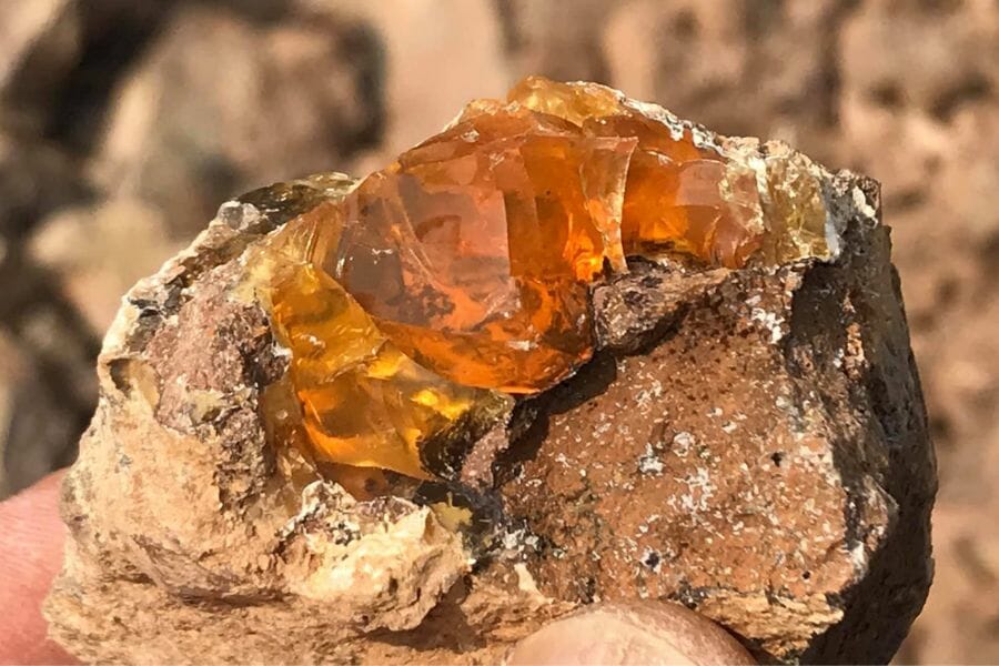 An uncut fire opal found at the Juniper Ridge Opal Mine