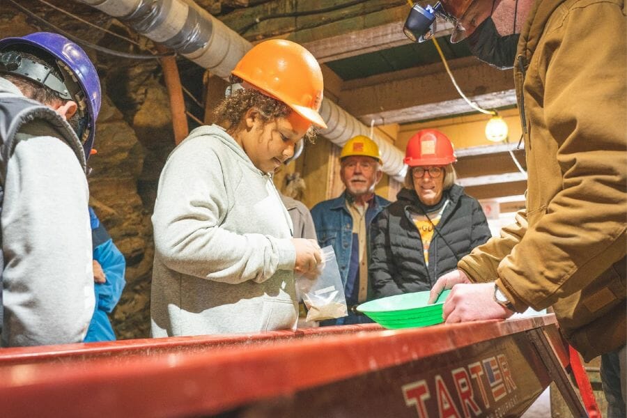 Kid panning gold at Phoenix Gold Mine