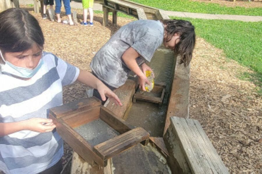 Two kids doing public gem mining in Kentucky