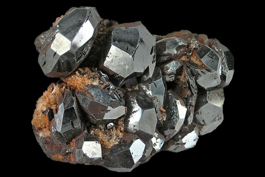 A shiny, silver Hematite against a black background