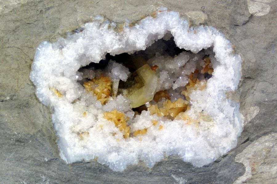 Barite geode with other pretty crystals inside
