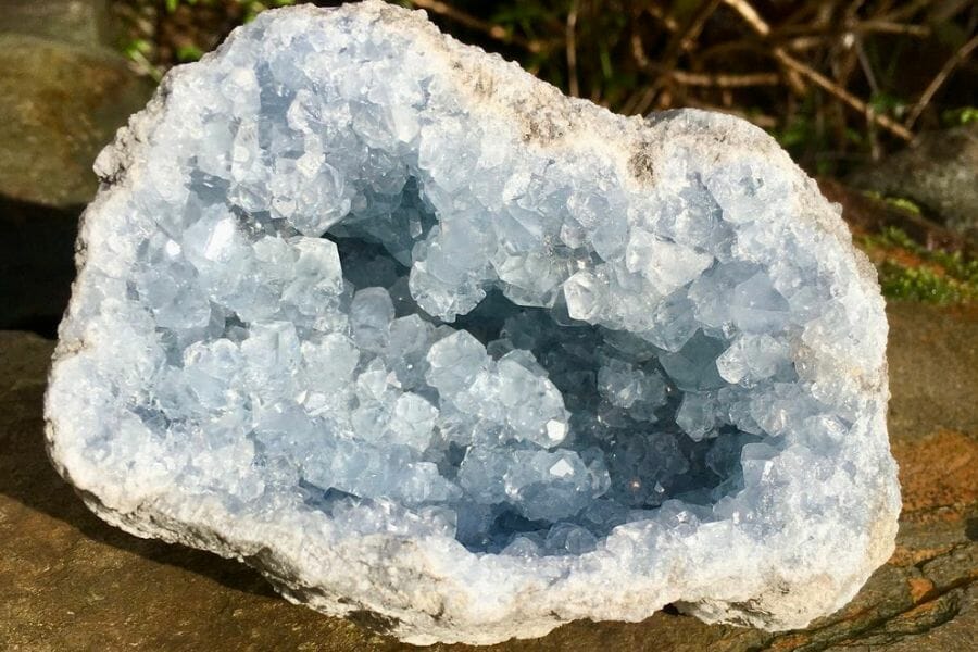 A gorgeous celestite geode placed on the ground