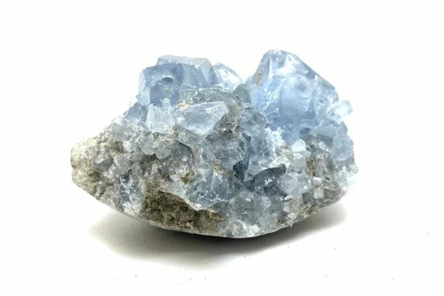 A tiny cut celestite geode with elegant blue crystals
