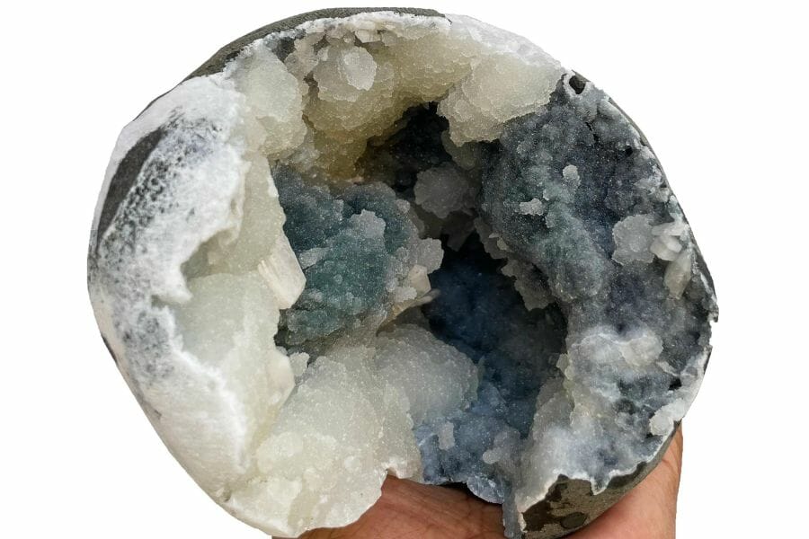 An elegant chalcedony geode with blue and black hues