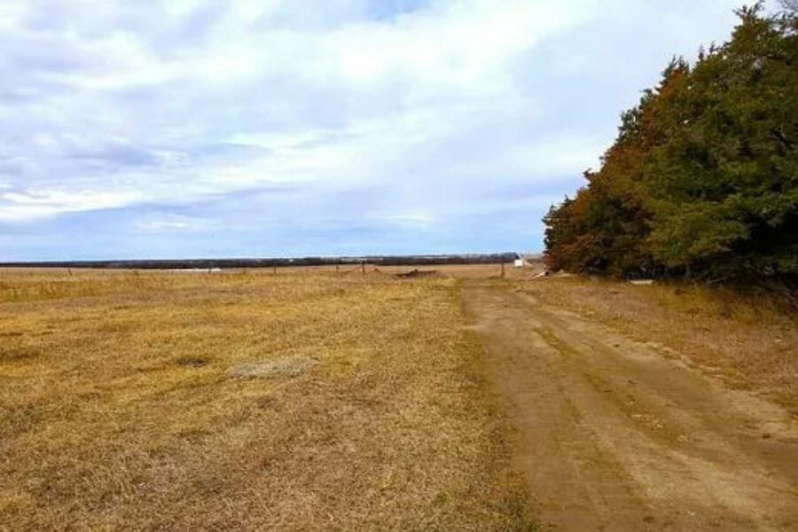 A plain land with lots of trees on the side at Gage County