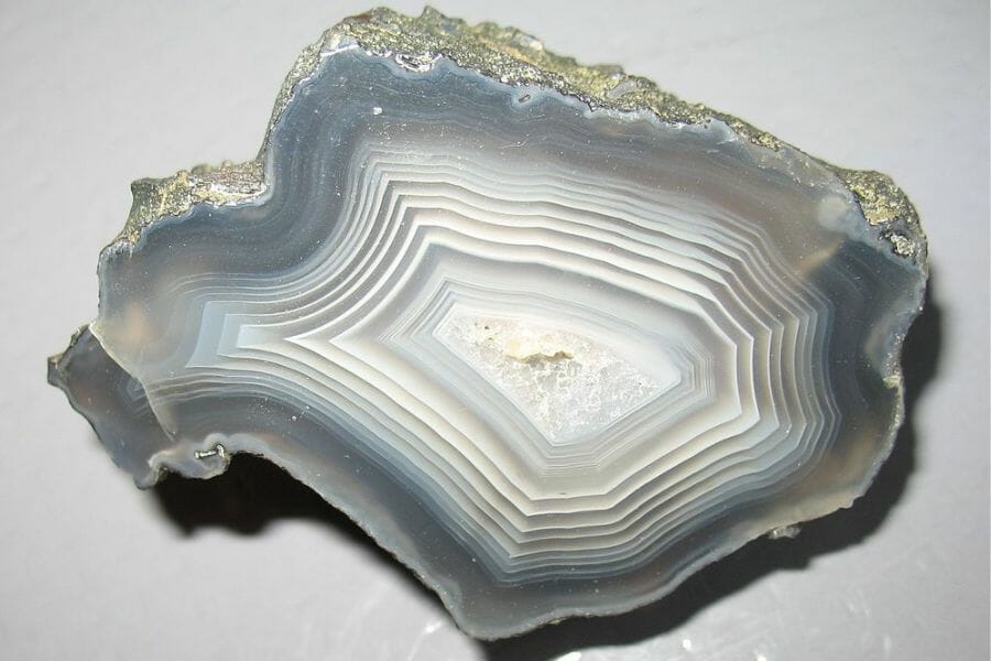 A gray-hue banded Agate on a gray surface