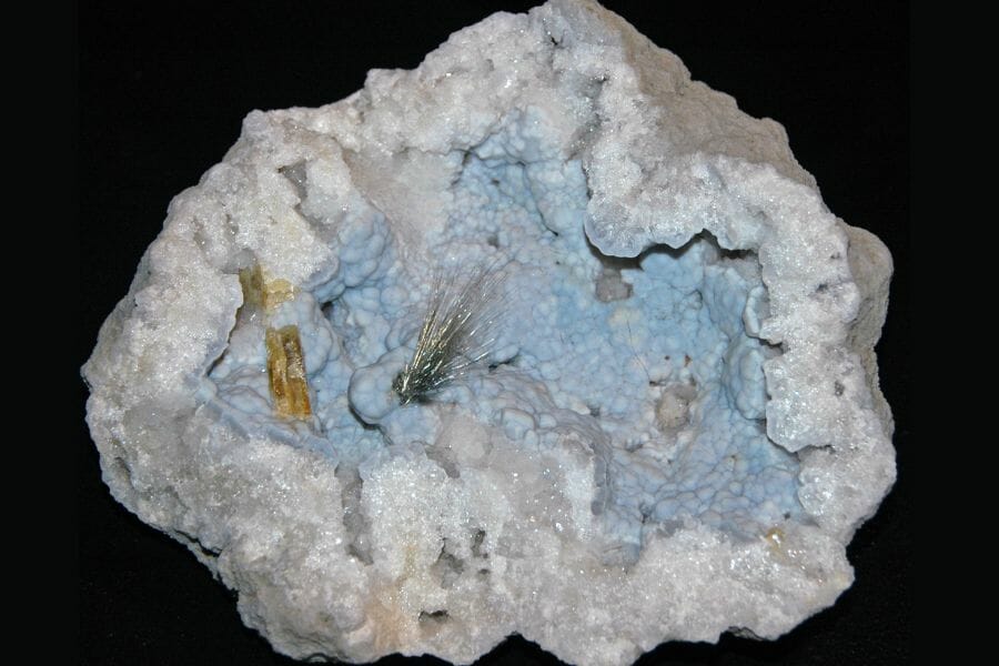A captivating sample of a Chalcedony geode with Millerite