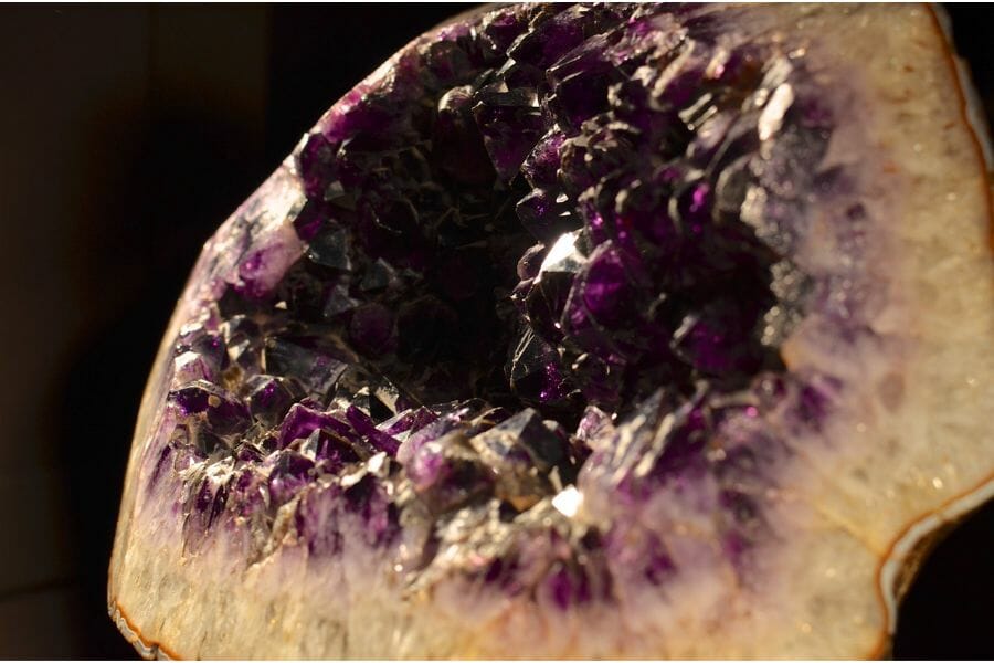 A close up photo of an amethyst geode from a museum