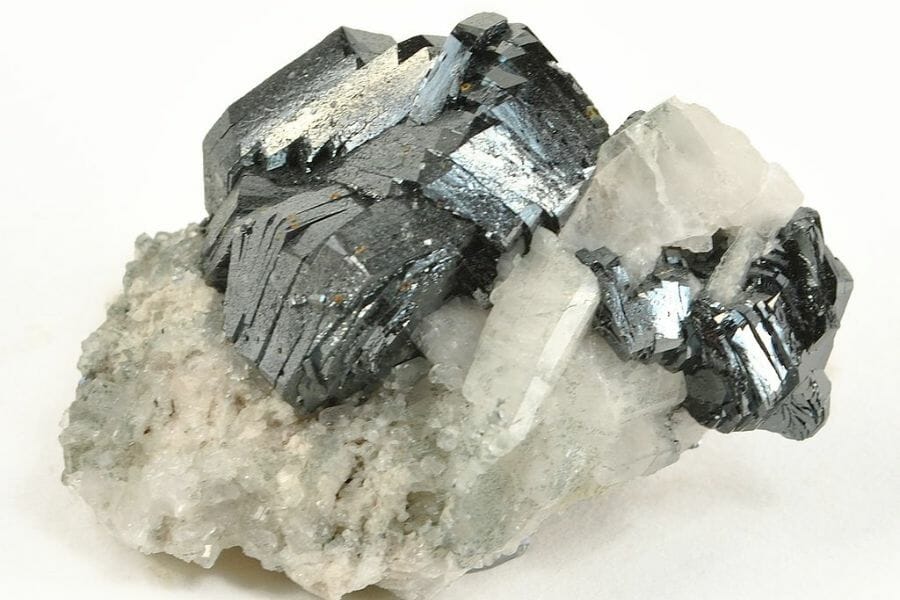 Beautiful pieces of silver Hematite attached to a calcite