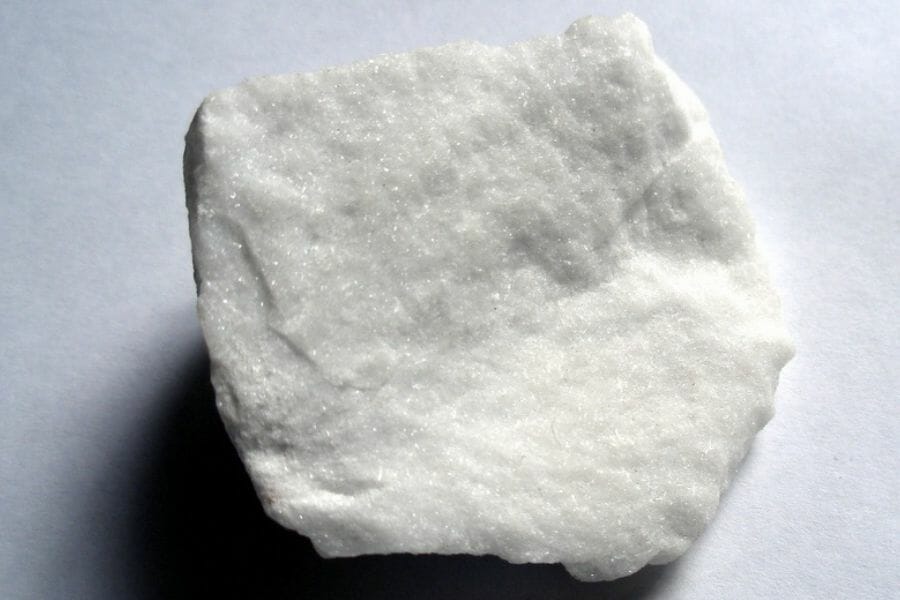 A white Anhydrite with visible sparkling crystal-like details