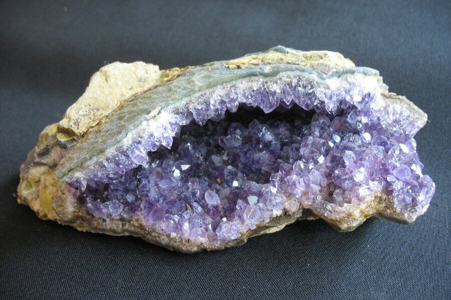 A unique amethyst geode with a flat oblong shape