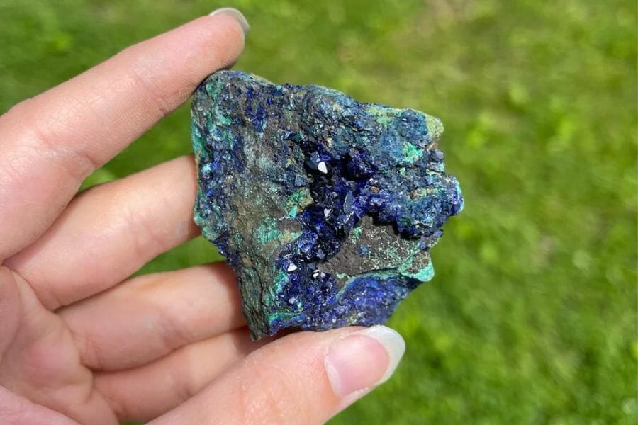 A gorgeous apatite with shades of blue and green and patches of gray minerals