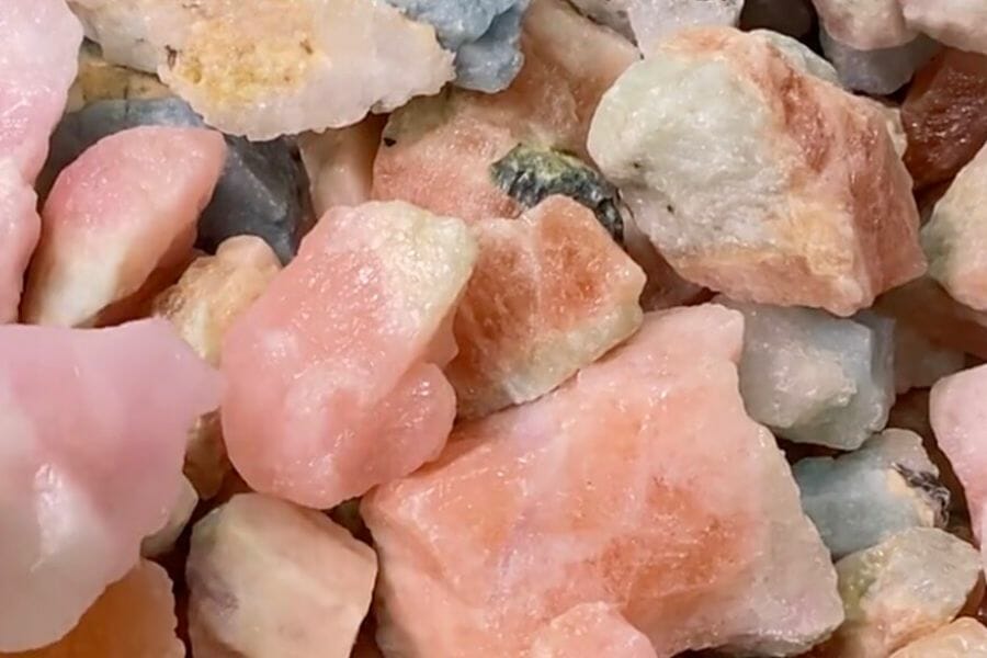A bunch of rough orange to pink Morganite crystals
