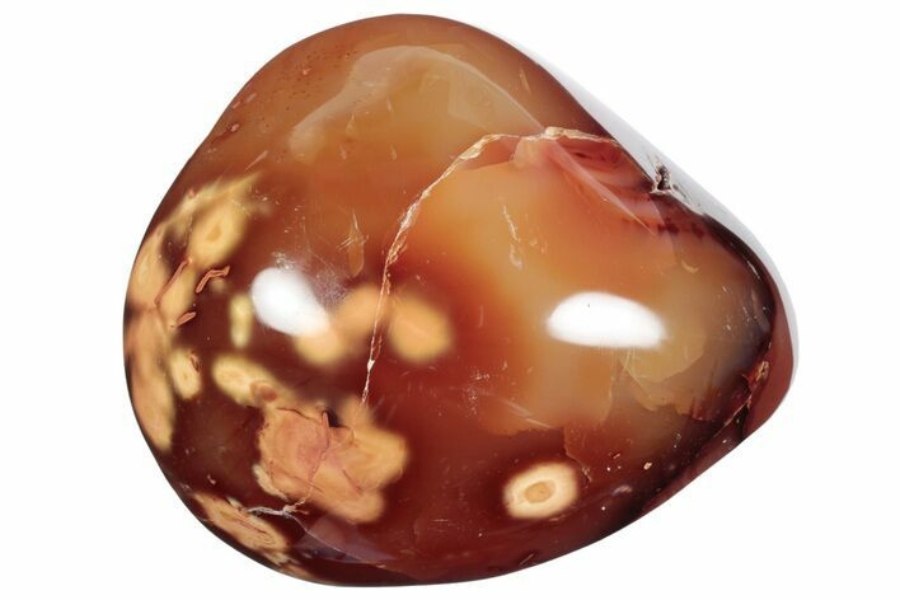 A beautifil polished carnelian gemstone with patterned spots