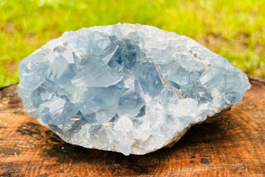 An elegant celestite crystal with white minerals at the bottom