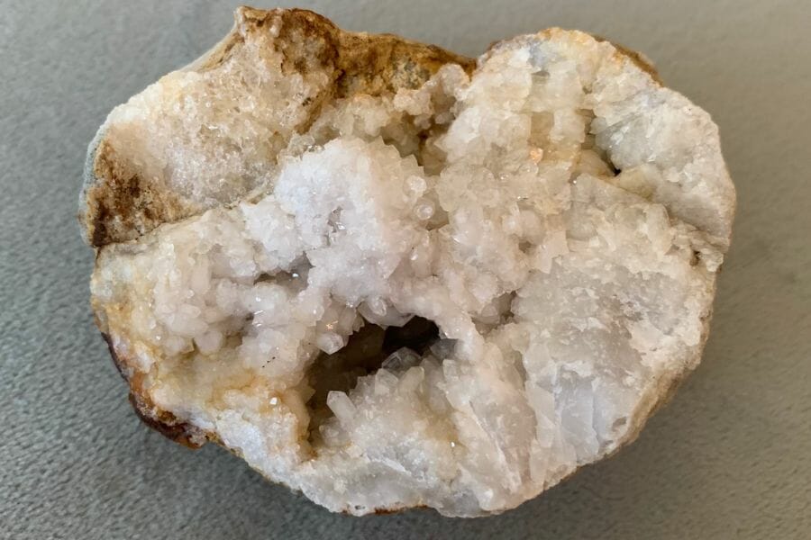A unique crystal geode with an irregular shape and uneven cut