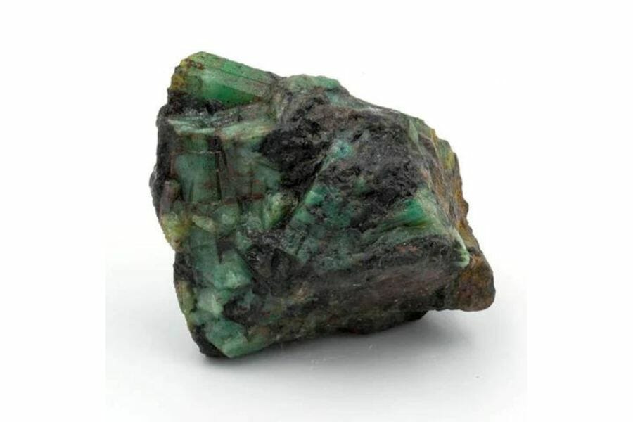 A gorgeous emerald covered in black minerals
