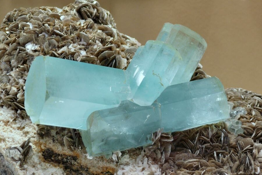 A bunch of Aquamarine crystals attached to Muscovite crystals