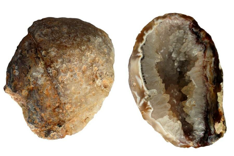 Two halves of a split-open grey-brown volcanic geode