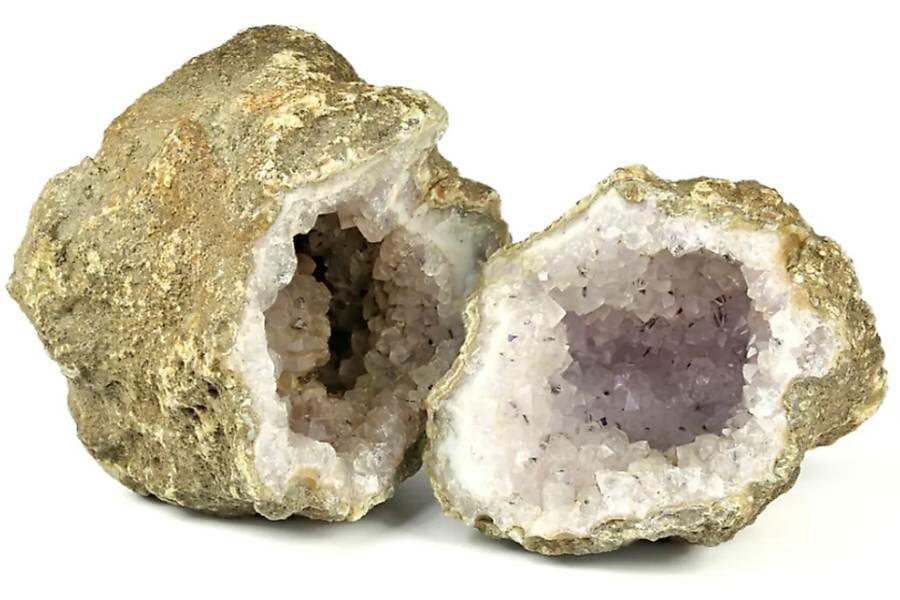 Goldish geode broken open exposing white crystals inside