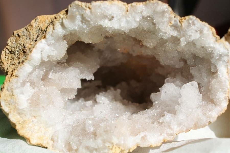 Large, open geode showing white crystals inside