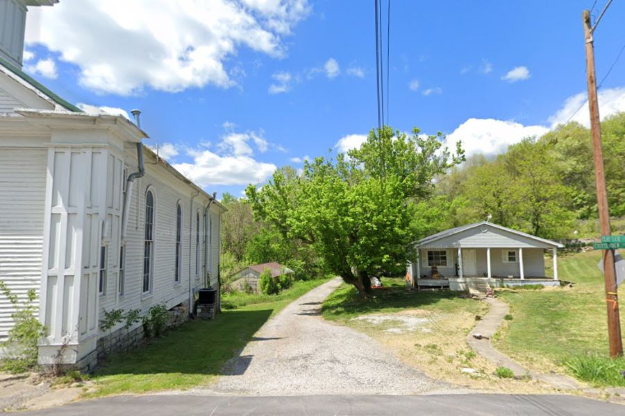 white buildings flanking a foot trail