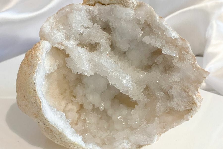 An open geode showing its white crystals inside