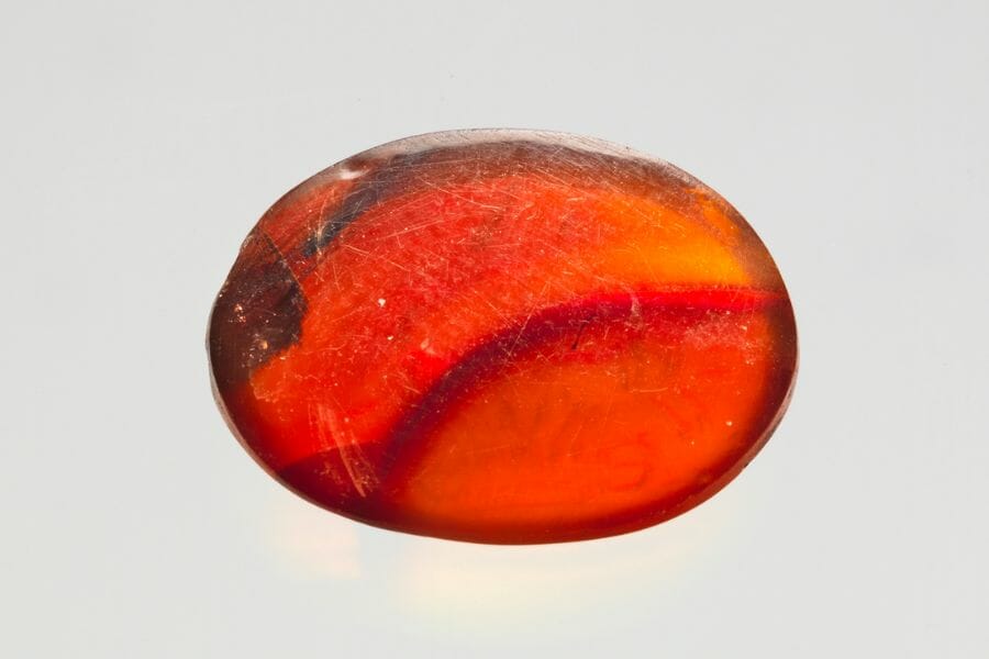 A spherical piece of orange Carnelian