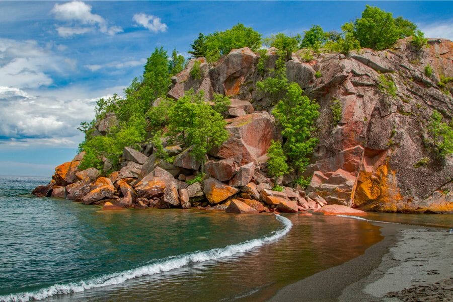 A stunning view of the waters and rock formations at one of the Lake Superior Beaches
