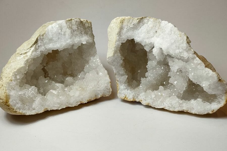 Two sides of a geode showing beautiful white crystals