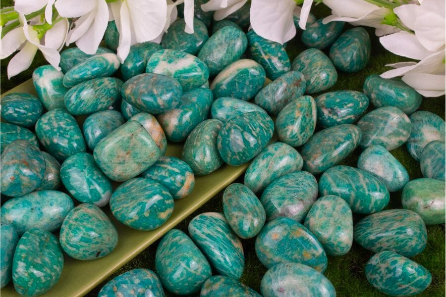 A bunch of polished blue green Amazonite crystals with white line details
