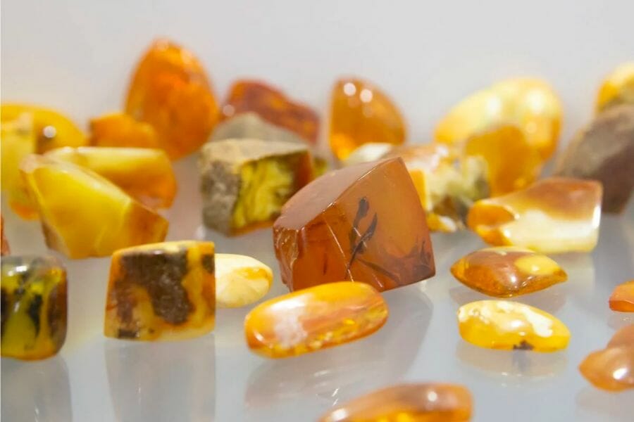 A bunch of rough Amber crystals showing its different intensities of yellow to orange hues