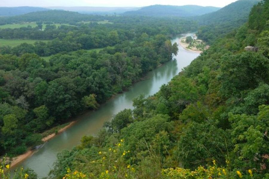 An aerial view of the features, including the river and forests in Tahlequah