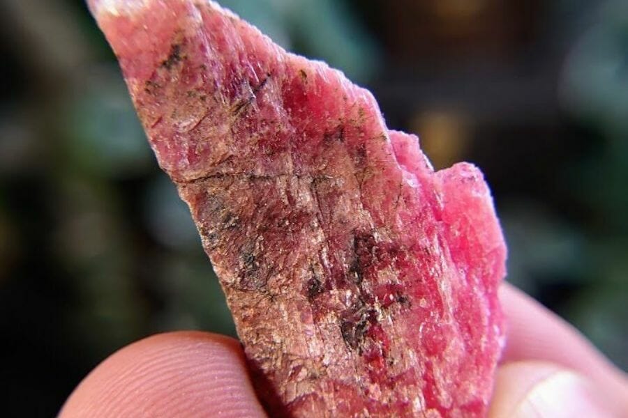 A beautiful rhodonite with black and white streaks