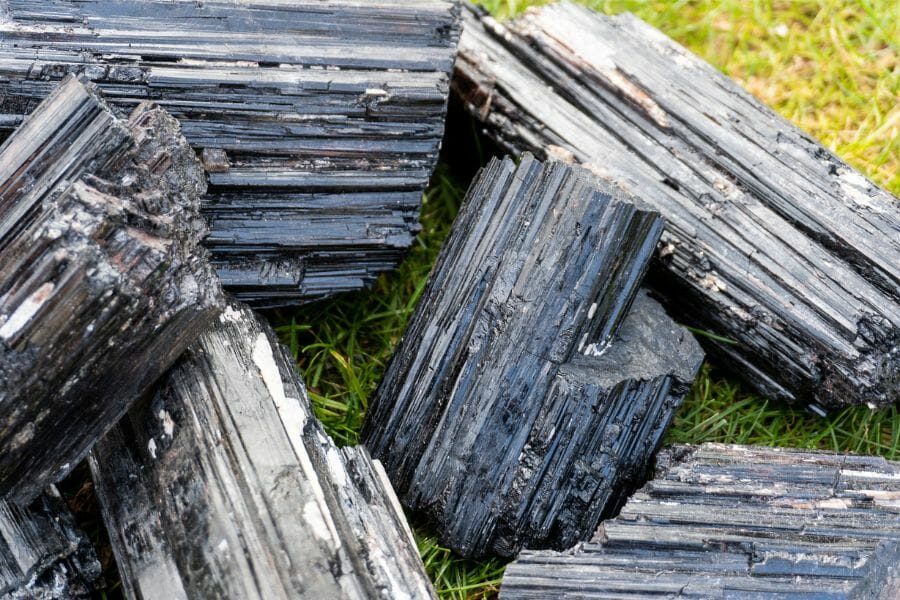 A few pieces of large tourmalin crystals on the grass